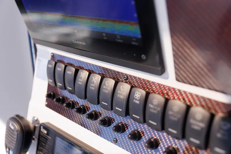  Yacht Photos Pics Control panel of 2025 Solara S-310 CW with switches and Garmin display.