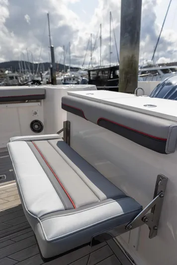  Yacht Photos Pics 2025 Solara S-310 CW boat seat with marina background.