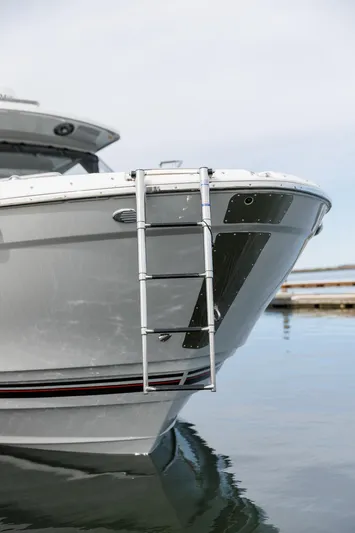  Yacht Photos Pics 2025 Solara S-310 CW boat with ladder on calm water.