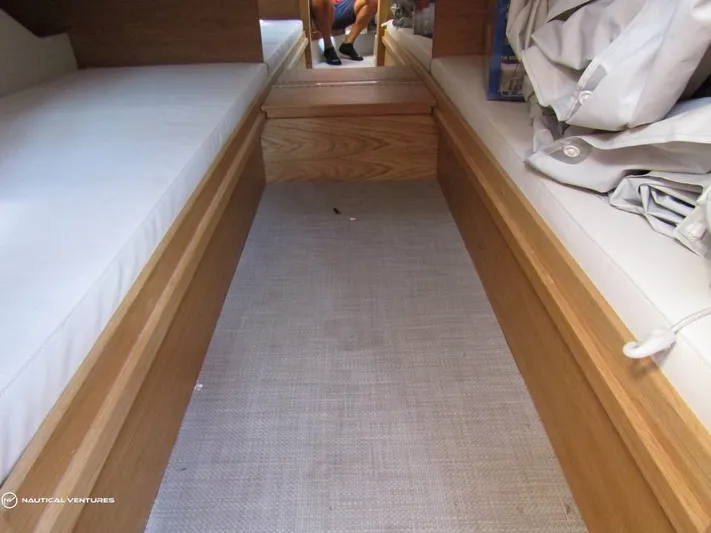  Yacht Photos Pics Interior cabin of 2022 De Antonio Yachts D34 Xplorer with twin beds and wooden finish.
