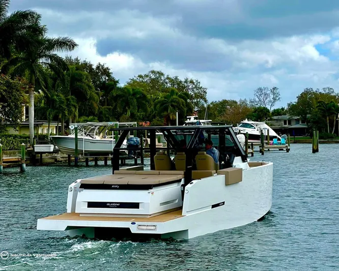  Yacht Photos Pics De Antonio Yachts D34 Xplorer 2022 cruising in a tropical marina.