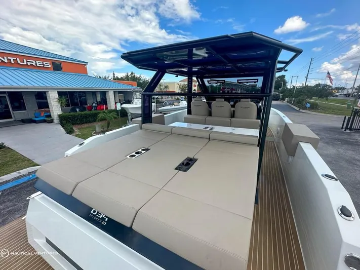  Yacht Photos Pics 2022 De Antonio Yachts D34 Xplorer luxury boat with spacious deck and seating.