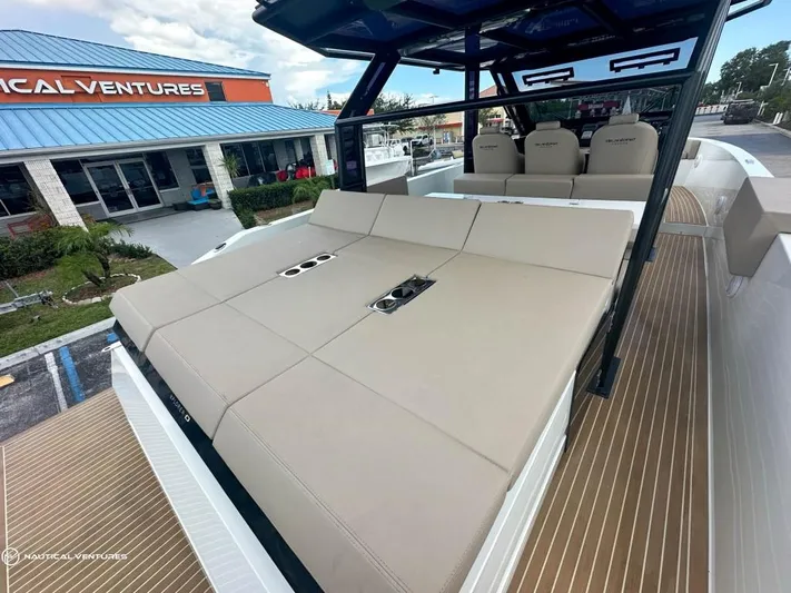  Yacht Photos Pics 2022 De Antonio Yachts D34 Xplorer with spacious sunbathing area and comfortable seating.
