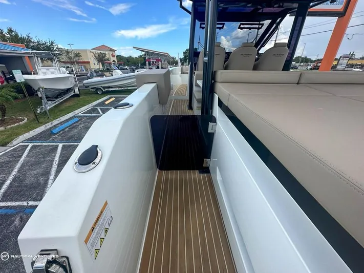  Yacht Photos Pics De Antonio Yachts D34 Xplorer 2022 model, deck view with seating and walkway.