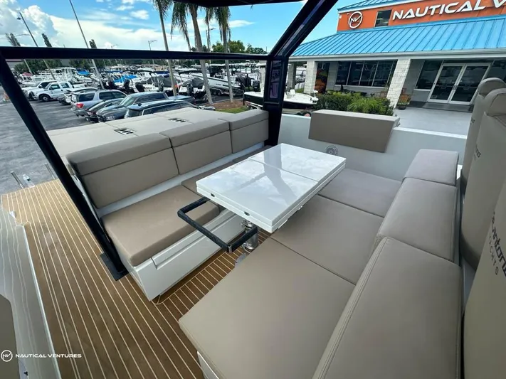  Yacht Photos Pics De Antonio Yachts D34 Xplorer 2022 model, spacious seating area with a foldable table.