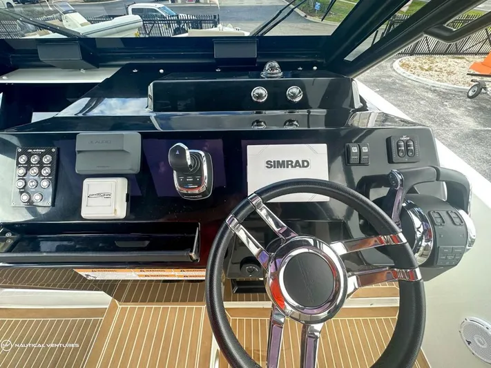  Yacht Photos Pics Cockpit of 2022 De Antonio Yachts D34 Xplorer with Simrad navigation system.