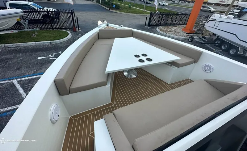  Yacht Photos Pics De Antonio Yachts D34 Xplorer 2022 model with spacious seating and table on deck.