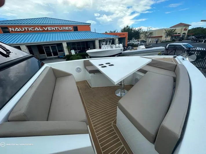  Yacht Photos Pics De Antonio Yachts D34 Xplorer 2022 model with outdoor seating and table at Nautical Ventures.