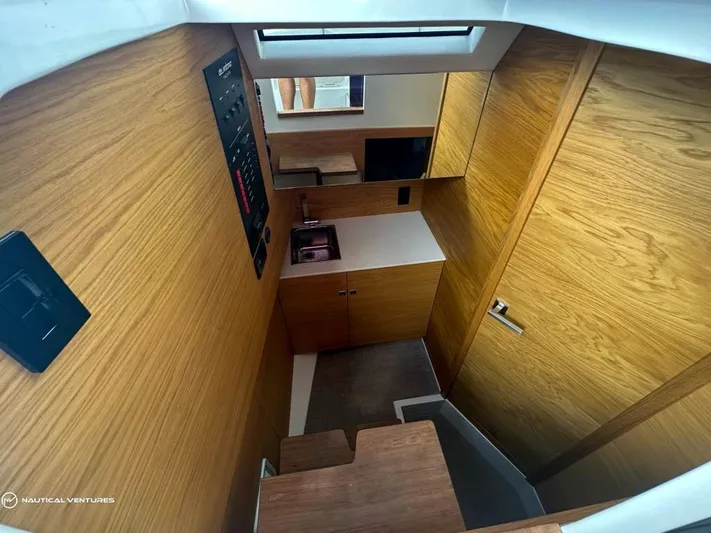  Yacht Photos Pics Interior of 2022 De Antonio Yachts D34 Xplorer with wooden cabinetry and modern design.