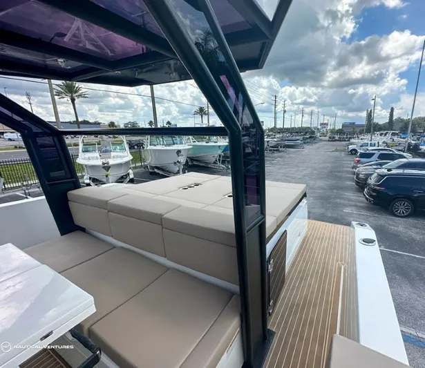  Yacht Photos Pics 2022 De Antonio Yachts D34 Xplorer, luxury boat interior with cushioned seating and modern design.