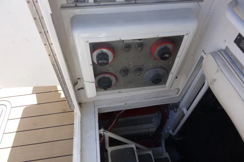 Aquila II Yacht Photos Pics Control panel on a 1990 Bertram 50 Convertible yacht, near engine room stairs.