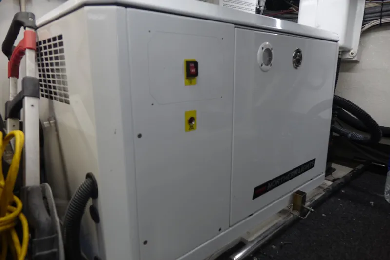 Aquila II Yacht Photos Pics Engine room of 1990 Bertram 50 Convertible yacht with generator and wiring.