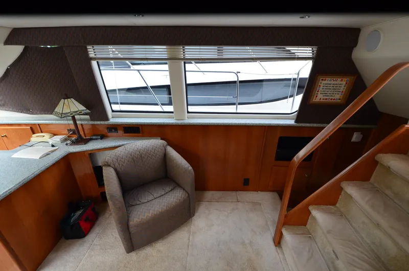 Radio Wave Yacht Photos Pics Interior of 2001 Carver 406 yacht with chair, stairs, and window view.