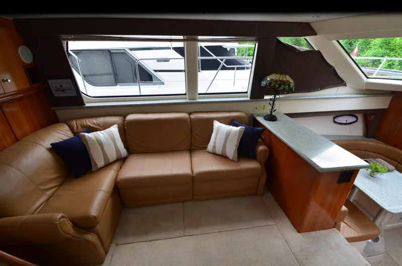 Radio Wave Yacht Photos Pics Luxurious interior of a 2001 Carver 406 yacht with leather seating and elegant decor.
