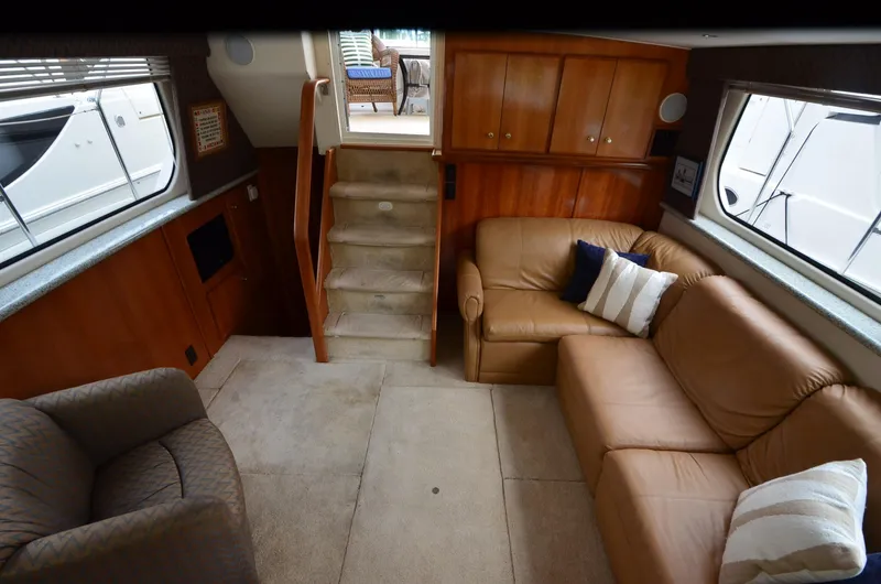 Radio Wave Yacht Photos Pics Interior of 2001 Carver 406 yacht with leather seating and wooden cabinetry.