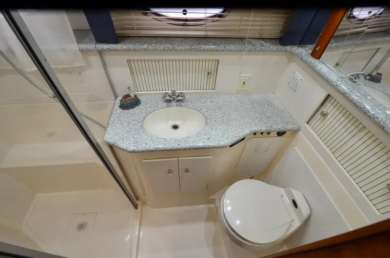 Radio Wave Yacht Photos Pics Bathroom interior of 2001 Carver 406 yacht with sink, toilet, and shower.