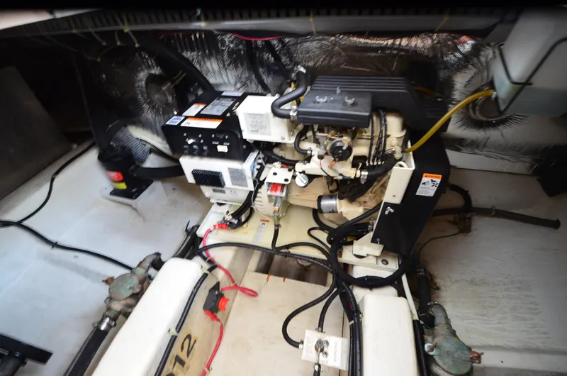 Radio Wave Yacht Photos Pics Engine room of a 2001 Carver 406 yacht, showcasing mechanical components and wiring.