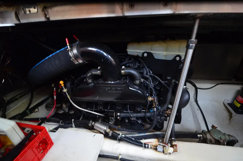 Radio Wave Yacht Photos Pics Engine compartment of a 2001 Carver 406 boat, showcasing mechanical components and hoses.