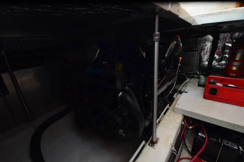 Radio Wave Yacht Photos Pics Engine room of a 2001 Carver 406 yacht, featuring mechanical components and storage.