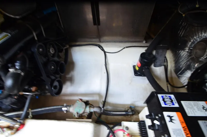 Radio Wave Yacht Photos Pics Engine compartment of a 2001 Carver 406 boat, showing mechanical components and wiring.