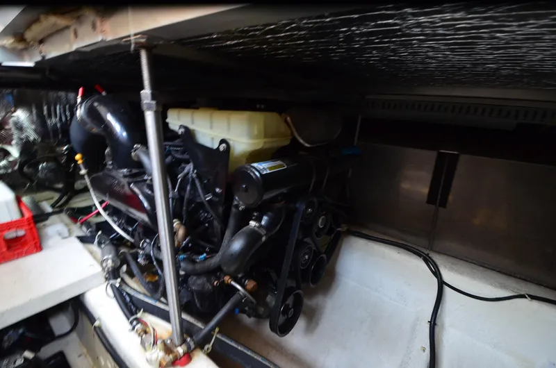 Radio Wave Yacht Photos Pics Engine compartment of a 2001 Carver 406 yacht, showcasing mechanical components and systems.