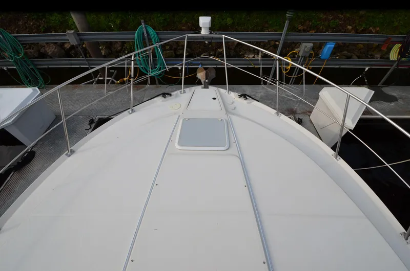 Radio Wave Yacht Photos Pics Bow view of a 2001 Carver 406 yacht docked, with visible deck and railings.