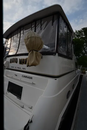 Radio Wave Yacht Photos Pics Carver 406 yacht, 2001 model, docked with covered windows, labeled "Radio Waves," West St. Paul, MN.