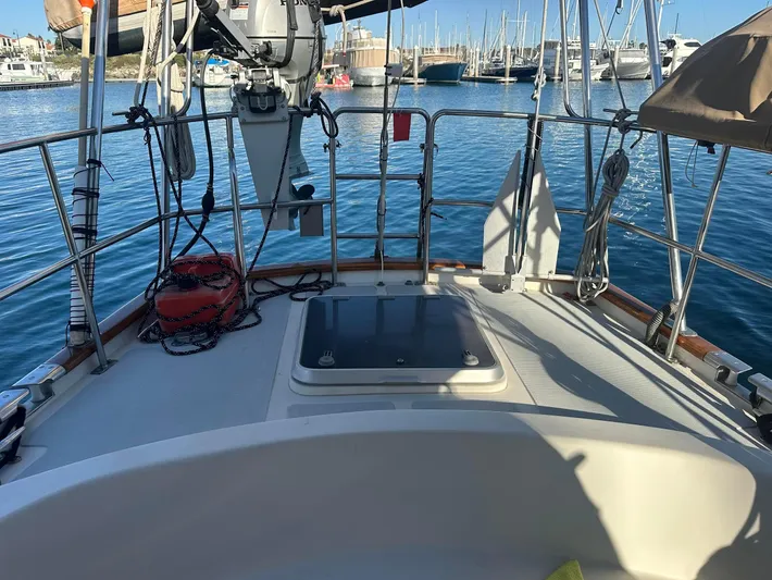 Joy Yacht Photos Pics Sailboat deck view with marina background, Passport Royal 43, 1999 model.