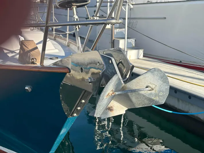 Joy Yacht Photos Pics Sailboat anchor detail on a 1999 Passport Royal 43, docked in a marina.