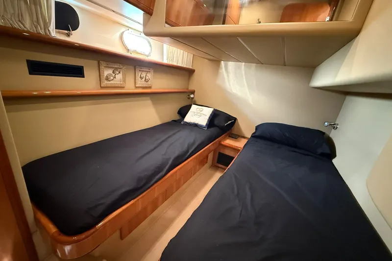  Yacht Photos Pics 2003 Ferretti Yachts 530 cabin with twin beds and elegant wood finish.