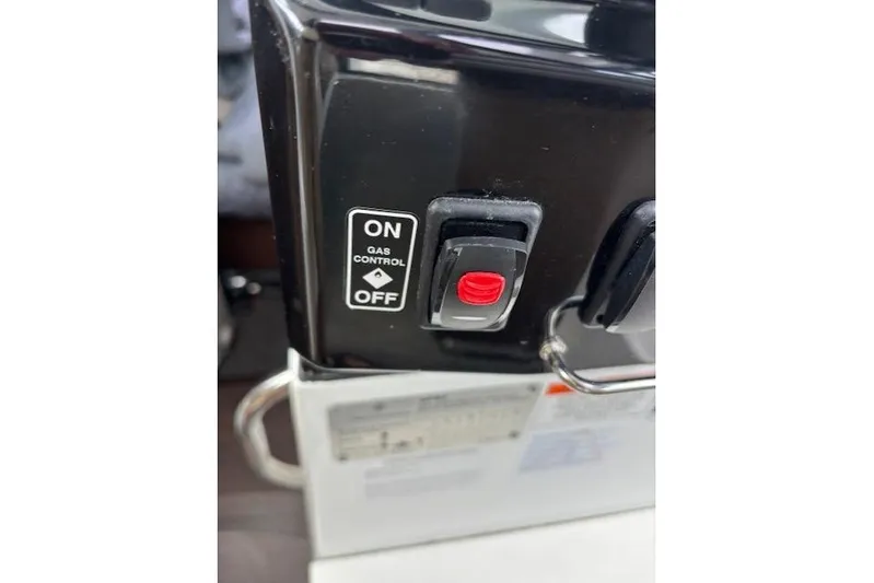  Yacht Photos Pics Gas control switch on a 2021 Jeanneau NC Sport 895 boat dashboard.