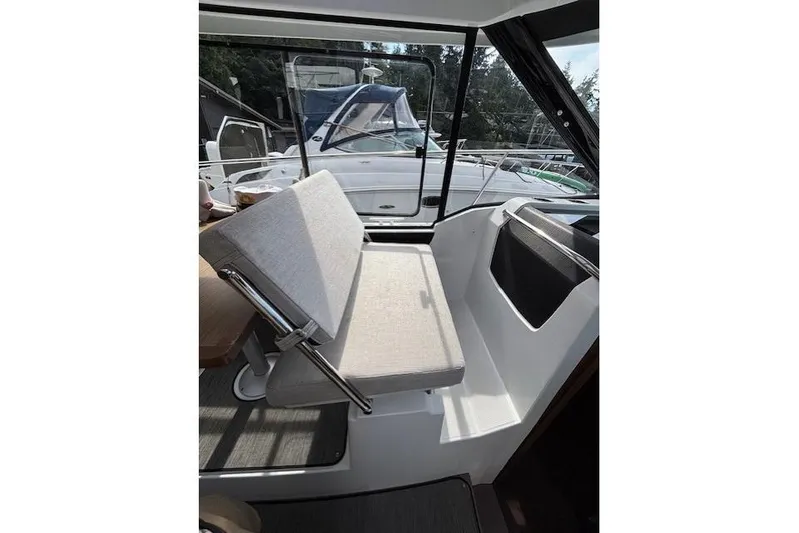  Yacht Photos Pics Interior view of 2021 Jeanneau NC Sport 895 boat with cushioned seating.