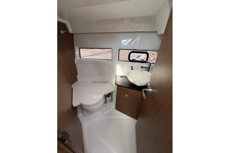  Yacht Photos Pics 2021 Jeanneau NC Sport 895 boat bathroom with modern sink and compact toilet.