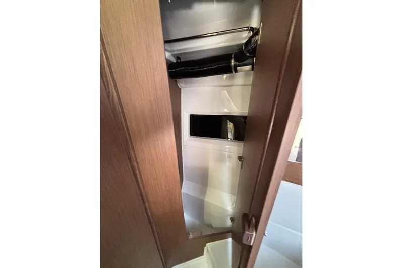  Yacht Photos Pics Interior view of 2021 Jeanneau NC Sport 895 boat, featuring a compact storage area.