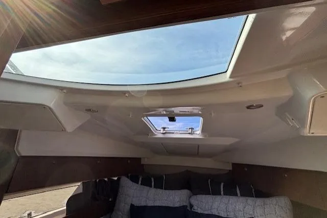  Yacht Photos Pics Interior view of 2021 Jeanneau NC Sport 895 boat cabin with skylight.