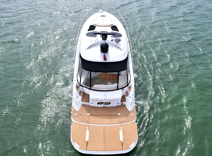 Epic Yacht Photos Pics 2009 Four Winns V458 yacht on open water, aerial view.