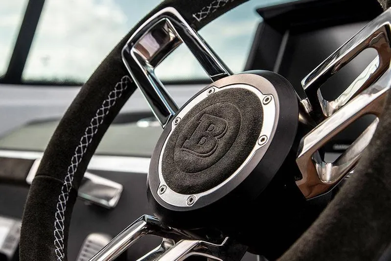  Yacht Photos Pics Close-up of 2022 Axopar 37 Cross Cabin steering wheel with detailed stitching.