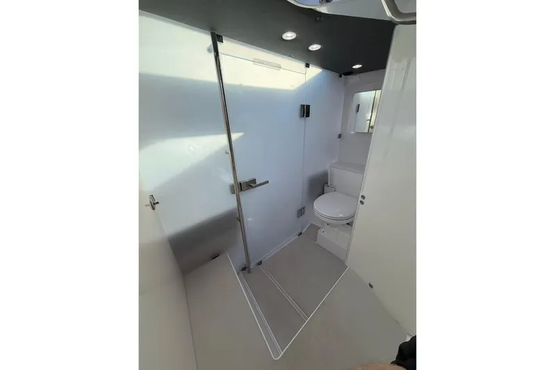  Yacht Photos Pics Modern bathroom interior of 2022 Axopar 37 XC Cross Cabin boat.