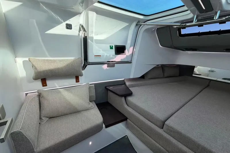  Yacht Photos Pics Interior of 2022 Axopar 37 XC Cross Cabin with modern seating and bedding.