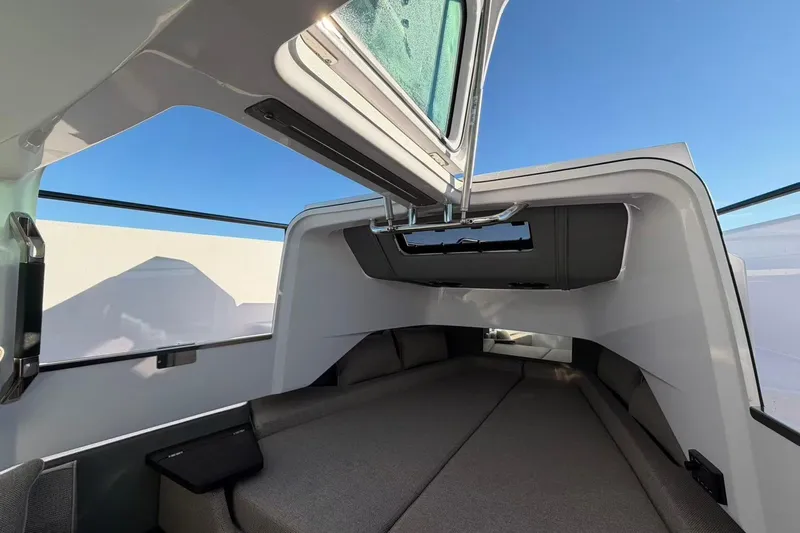  Yacht Photos Pics Interior cabin of 2022 Axopar 37 XC Cross Cabin with skylight and seating.