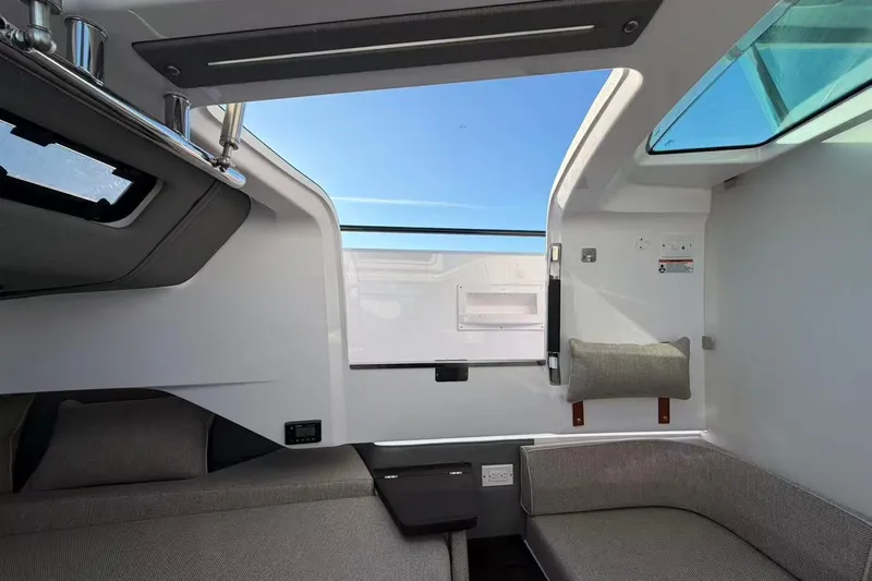  Yacht Photos Pics Interior of 2022 Axopar 37 XC Cross Cabin with modern seating and skylight.