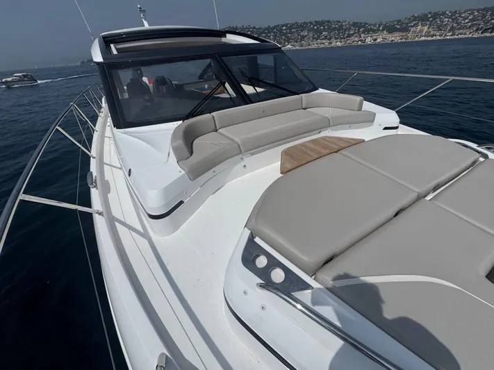  Yacht Photos Pics 2024 Princess V55 yacht with sleek design and spacious deck on open water.