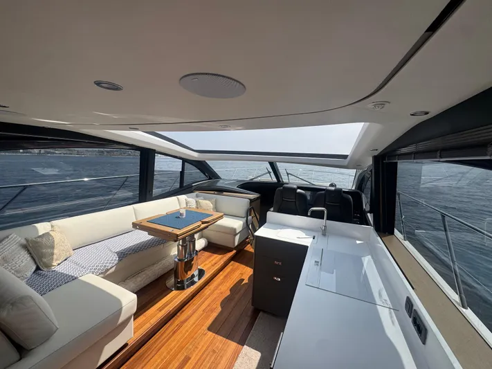  Yacht Photos Pics Luxurious interior of 2024 Princess V55 yacht with elegant seating and ocean view.