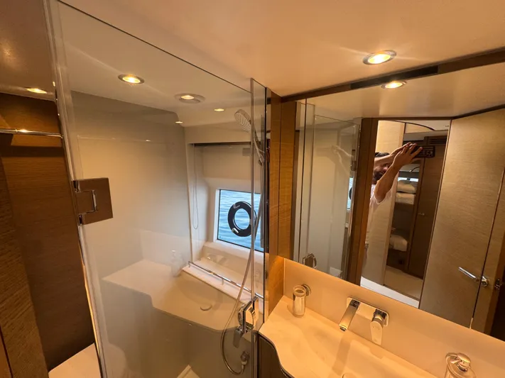  Yacht Photos Pics Luxurious bathroom interior of 2024 Princess V55 yacht with modern fixtures and elegant design.