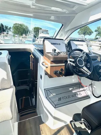 Three Beaches Yacht Photos Pics 2020 Four Winns Vista 355 Coupe OB helm with Simrad displays and luxurious interior.