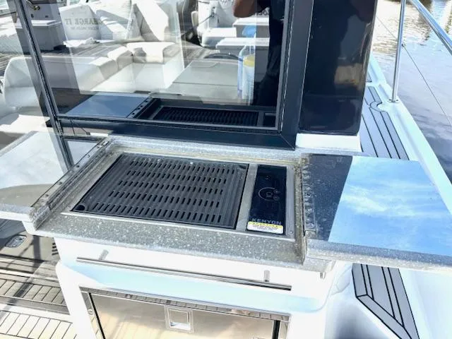 Three Beaches Yacht Photos Pics Outdoor grill on 2020 Four Winns Vista 355 Coupe OB yacht deck.