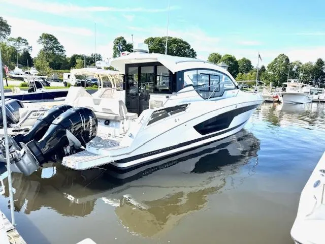 Three Beaches Yacht Photos Pics 2020 Four Winns Vista 355 Coupe OB docked in a marina, featuring sleek design and powerful engines.