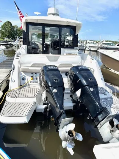 Three Beaches Yacht Photos Pics 2020 Four Winns Vista 355 Coupe OB with dual outboard engines at marina.