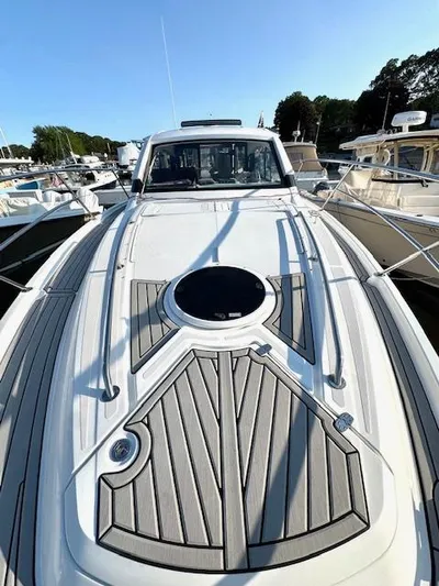 Three Beaches Yacht Photos Pics 2020 Four Winns Vista 355 Coupe OB boat deck, docked in marina.