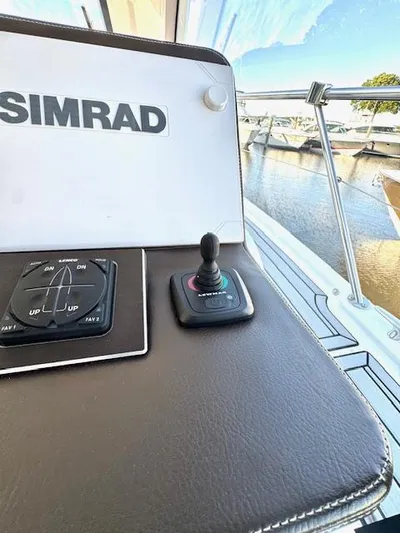 Three Beaches Yacht Photos Pics Control panel of 2020 Four Winns Vista 355 Coupe OB with Simrad system, dockside view.